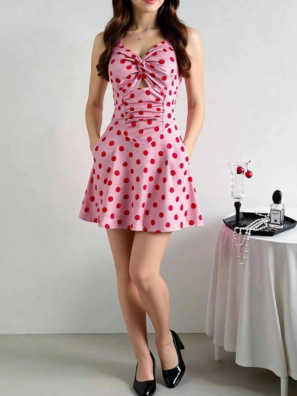Polka Dot Halter Neck Mini Dress with Twisted Front Design