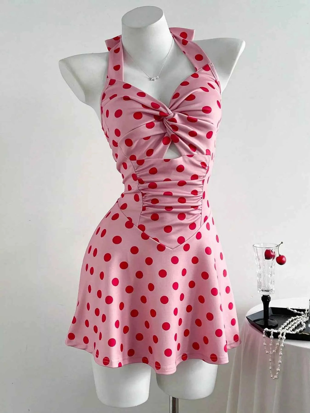 Polka Dot Halter Neck Mini Dress with Twisted Front Design