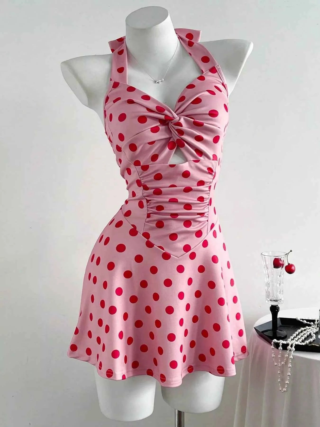 Polka Dot Halter Neck Mini Dress with Twisted Front Design