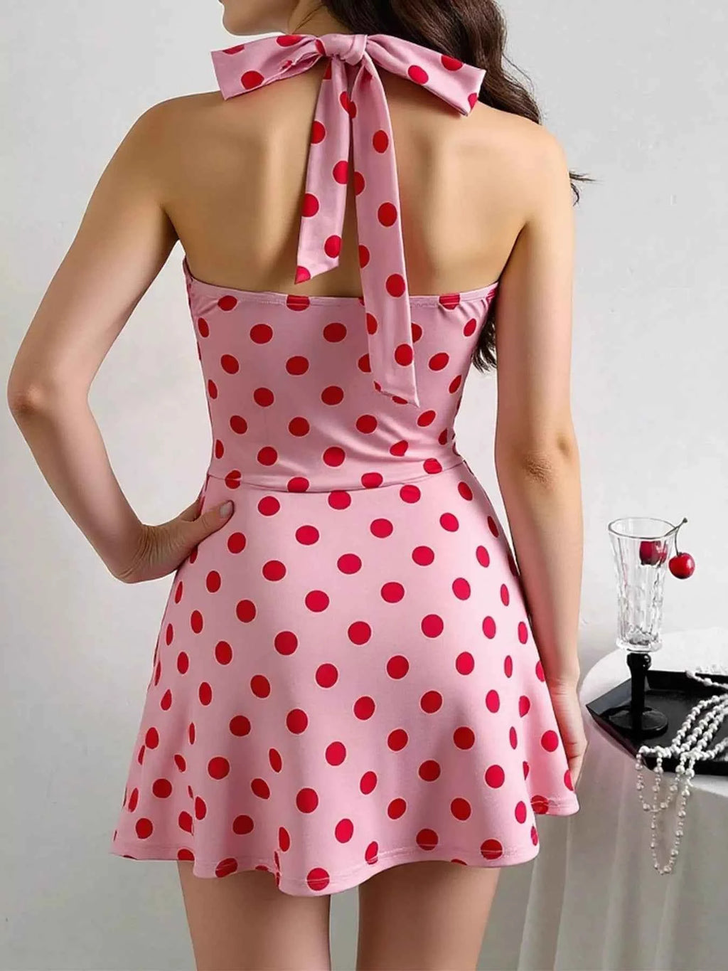 Polka Dot Halter Neck Mini Dress with Twisted Front Design